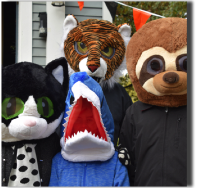 Handling out treats during the annual Heritage Days Halloween Fun Fest!
